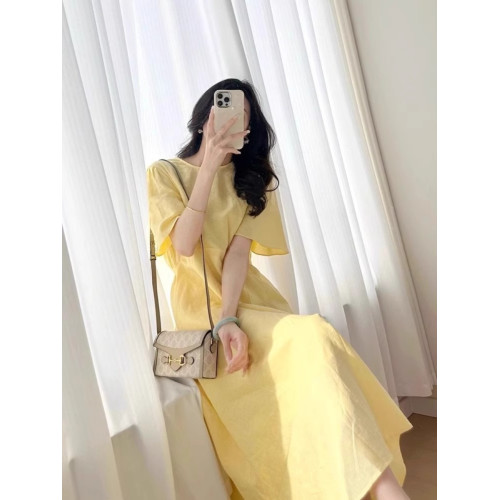 歐洲站夏季女裝2025新款茶歇法式桔梗長裙遮肚子顯瘦黃色連衣裙